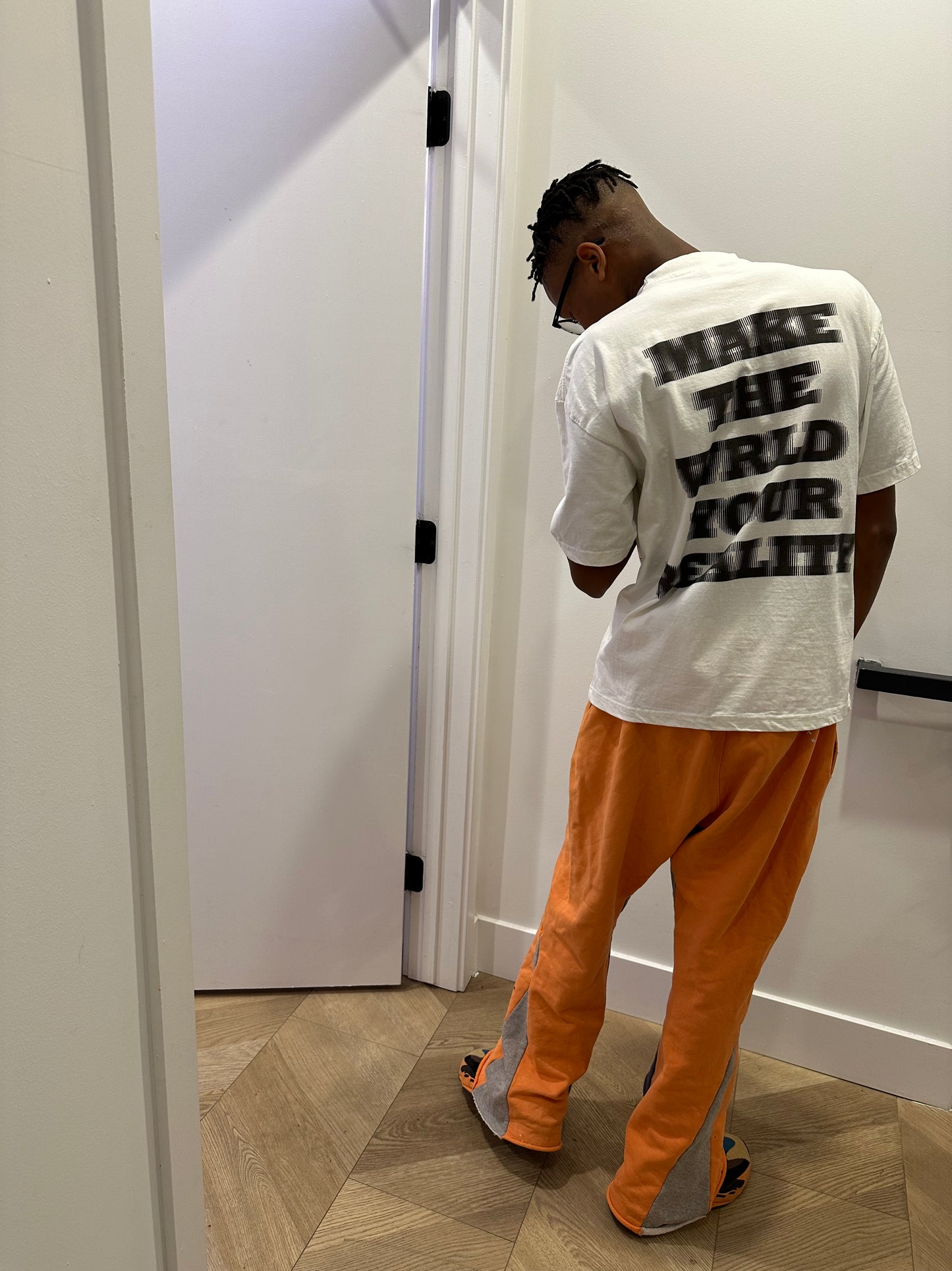 MAKE THE WRLD YOUR REALITY TEE