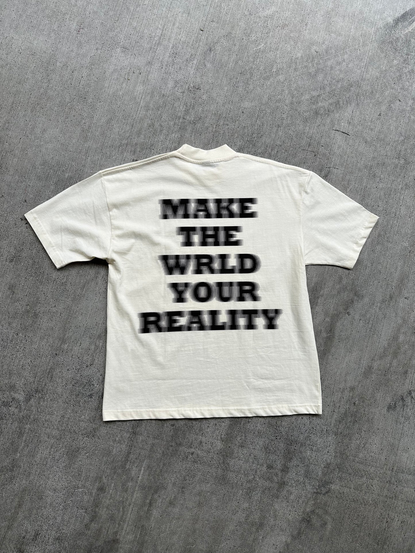 MAKE THE WRLD YOUR REALITY TEE
